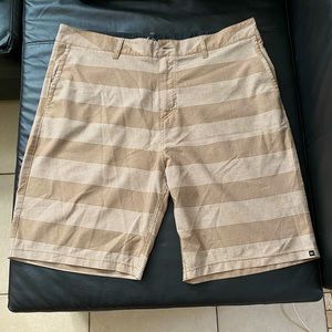 Quick Silver tan striped swim trunks.